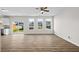 Spacious living room featuring a ceiling fan and sliding glass doors to the backyard at 2150 Pimlico Dr, Ridgeville, SC 29472