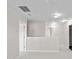 Upstairs loft area with neutral carpeting and access to multiple rooms at 2150 Pimlico Dr, Ridgeville, SC 29472