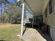 The home features a covered back patio and porch perfect for enjoying outdoor living and entertaining at 2164 Highway 78, Dorchester, SC 29437