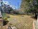 Spacious backyard featuring a lush lawn and mature trees, perfect for outdoor activities and relaxation at 2164 Highway 78, Dorchester, SC 29437