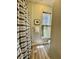 View of a well-lit bathroom featuring decorative tile, a shower with a stylish curtain, and a window at 2164 Highway 78, Dorchester, SC 29437