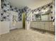 Large bathroom featuring stylish floral wallpaper, shower, and large vanity at 2164 Highway 78, Dorchester, SC 29437