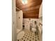Loft bathroom with shower, toilet, sink, storage and wood-paneled ceiling at 2164 Highway 78, Dorchester, SC 29437