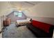 Finished attic bedroom with a pitched ceiling, carpeted floors, a bed, futon, and dresser at 2164 Highway 78, Dorchester, SC 29437