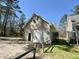 Exterior view of a two-story garage with white siding, a large garage door, and a clean design at 2164 Highway 78, Dorchester, SC 29437