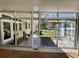 Open sunroom with sliding glass windows overlooking the backyard and wood patio at 2164 Highway 78, Dorchester, SC 29437