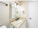 Well-lit bathroom featuring granite countertop, dark fixtures, and vanity with a mirror at 2306 Chairmaker Ct, Charleston, SC 29414