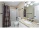 Well-lit bathroom featuring vanity with granite countertop, dark fixtures, and shower-tub combination at 2306 Chairmaker Ct, Charleston, SC 29414