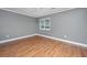 Bedroom featuring hardwood floors, neutral gray paint, and a window at 2306 Chairmaker Ct, Charleston, SC 29414