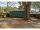 Exterior view of a green storage shed with double doors, ideal for extra storage at 2306 Chairmaker Ct, Charleston, SC 29414