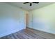 Neutrally decorated bedroom with ceiling fan and wood-look flooring at 2314 Kent Ave, North Charleston, SC 29405