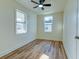 Bright bedroom with ceiling fan, natural light, and wood-look flooring at 2314 Kent Ave, North Charleston, SC 29405