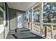 Inviting front porch with white railing and gray exterior at 2314 Kent Ave, North Charleston, SC 29405