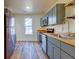 Modern kitchen with stainless steel appliances, wooden countertops, and gray cabinets at 2314 Kent Ave, North Charleston, SC 29405