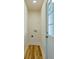 Dedicated laundry room with wood-look flooring and exterior door to the backyard at 2314 Kent Ave, North Charleston, SC 29405