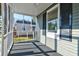 View from screened-in porch, showcasing gray exterior and view of the yard at 2314 Kent Ave, North Charleston, SC 29405