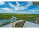 Balcony view of the marsh and clear blue sky at 242 Little Oak Dr, Folly Beach, SC 29439