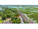 Waterfront property with lush greenery, scenic waterways, and well-maintained townhomes offering a unique coastal lifestyle at 242 Little Oak Dr, Folly Beach, SC 29439