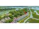 Aerial view of townhomes nestled amidst lush greenery and waterways, showcasing the community's scenic location at 242 Little Oak Dr, Folly Beach, SC 29439