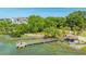 Beautiful aerial view of a blue home with a private dock and covered gazebo along the shoreline at 242 Little Oak Dr, Folly Beach, SC 29439
