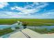 Relax on this balcony with views of the stunning marsh and waterway at 242 Little Oak Dr, Folly Beach, SC 29439
