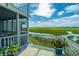 Relax on this balcony, which features scenic views of the marsh at 242 Little Oak Dr, Folly Beach, SC 29439