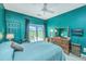Charming bedroom with marsh view, TV and a dresser at 242 Little Oak Dr, Folly Beach, SC 29439