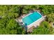 Aerial view of a community pool surrounded by lush trees at 242 Little Oak Dr, Folly Beach, SC 29439