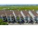 Beautiful townhomes with stunning marsh views and well-maintained landscaping offer a serene coastal lifestyle at 242 Little Oak Dr, Folly Beach, SC 29439