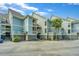 Well-maintained townhomes with parking spaces and lush landscaping create a welcoming and convenient living environment at 242 Little Oak Dr, Folly Beach, SC 29439