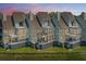 A charming row of townhomes with expansive windows and private balconies at 242 Little Oak Dr, Folly Beach, SC 29439
