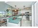 Bright, open kitchen with modern appliances and seamless access to dining room at 242 Little Oak Dr, Folly Beach, SC 29439