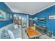 Relaxing living room features comfortable seating with a view to the exterior balcony at 242 Little Oak Dr, Folly Beach, SC 29439