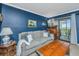 Living room with comfortable seating and a view to the exterior balcony at 242 Little Oak Dr, Folly Beach, SC 29439