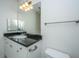 Bathroom featuring vanity with dark countertop and cabinets and framed mirror at 2522 Egret Crest Ln, Charleston, SC 29414