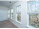 Bedroom with multiple windows showing outdoor views and white trim at 2522 Egret Crest Ln, Charleston, SC 29414