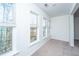 Bright bedroom with large windows offering natural light and a view of the outdoors at 2522 Egret Crest Ln, Charleston, SC 29414
