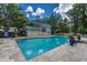 Resort-style community pool featuring a clubhouse and lounge chairs for relaxing at 2522 Egret Crest Ln, Charleston, SC 29414
