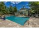 Sparkling community pool with inviting lounge area and verdant trees at 2522 Egret Crest Ln, Charleston, SC 29414