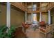 Charming courtyard with outdoor seating and lush landscaping beneath a multi-story deck at 2522 Egret Crest Ln, Charleston, SC 29414