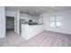 Bright kitchen with stainless steel appliances, a breakfast bar, and views of the living room at 2522 Egret Crest Ln, Charleston, SC 29414