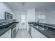 Modern kitchen with granite countertops, stainless steel appliances, and ample storage space at 2522 Egret Crest Ln, Charleston, SC 29414