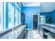 Bright kitchenette with stainless sink, granite countertops, and blue walls perfect for entertaining guests at 2522 Egret Crest Ln, Charleston, SC 29414