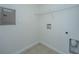 Compact laundry area featuring tile flooring and convenient shelving storage space at 2522 Egret Crest Ln, Charleston, SC 29414