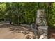 Stone outdoor fireplace and grill area offers a cozy spot to gather and relax at 2522 Egret Crest Ln, Charleston, SC 29414