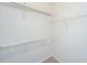 Walk-in closet featuring wire shelving and neutral carpet at 2522 Egret Crest Ln, Charleston, SC 29414