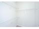 Walk-in closet featuring wire shelving and neutral carpet at 2522 Egret Crest Ln, Charleston, SC 29414