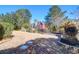 Lush backyard featuring a pond and view of neighboring houses, enhanced by stone pavers at 2707 Waterpointe Cir, Mount Pleasant, SC 29466