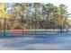 Outdoor basketball court surrounded by a fence and trees offering a fun recreational amenity for residents at 2707 Waterpointe Cir, Mount Pleasant, SC 29466