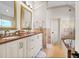 Bathroom with double sinks, marble countertops, glass shower and soaking tub at 2707 Waterpointe Cir, Mount Pleasant, SC 29466